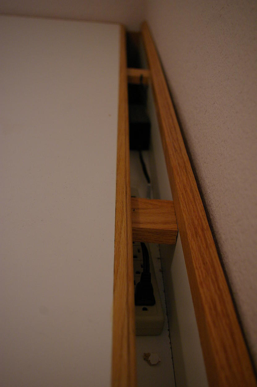 Baby proofing - View of channel with power strip and printer power supply